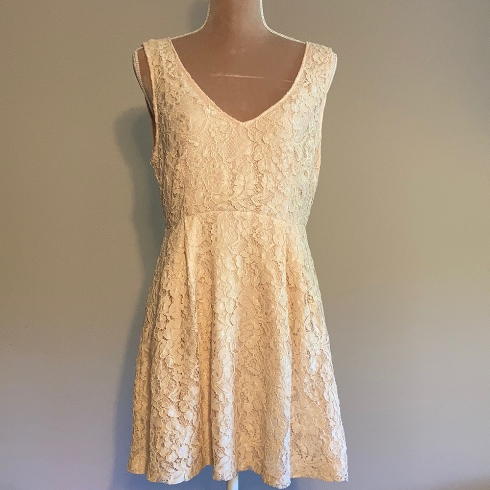 Forever 21 creamy / peachy dress with V neckline and low cut V back. Size Large